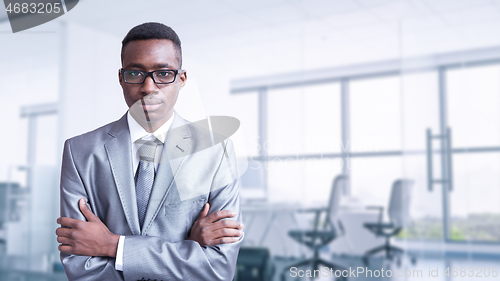 Image of Young businessman in his office