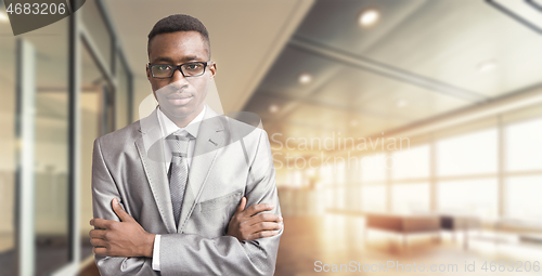 Image of Young businessman in his office