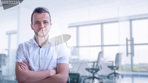 Image of Young businessman in his office