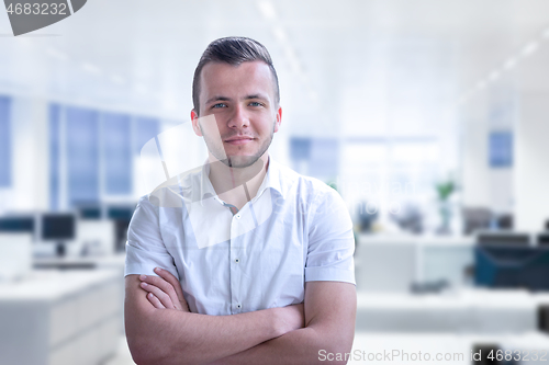 Image of Young businessman in his office