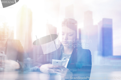 Image of Business Girl Standing In A Modern Building Near The Window With