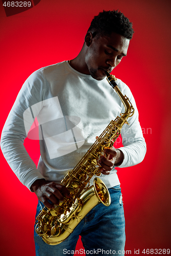 Image of African American jazz musician playing the saxophone.