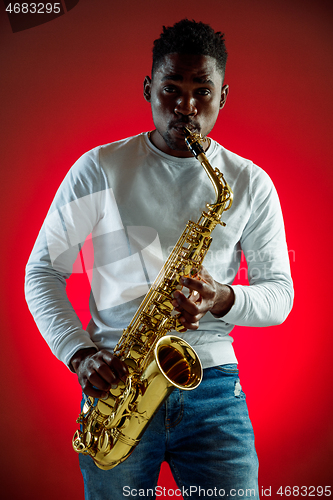 Image of African American jazz musician playing the saxophone.