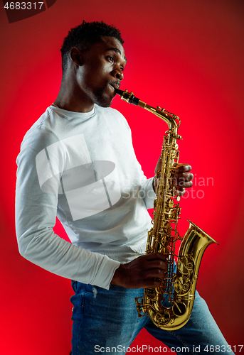 Image of African American jazz musician playing the saxophone.