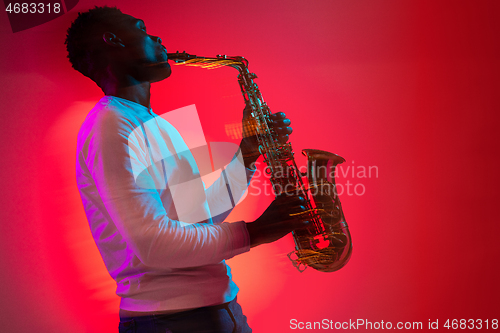 Image of African American jazz musician playing the saxophone.