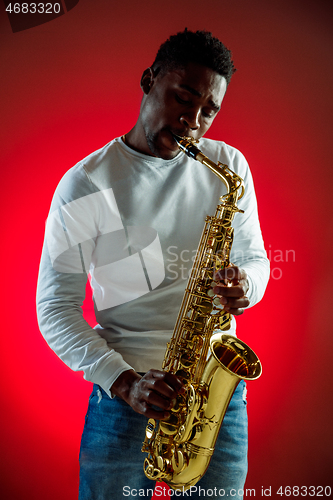 Image of African American jazz musician playing the saxophone.