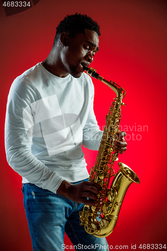 Image of African American jazz musician playing the saxophone.