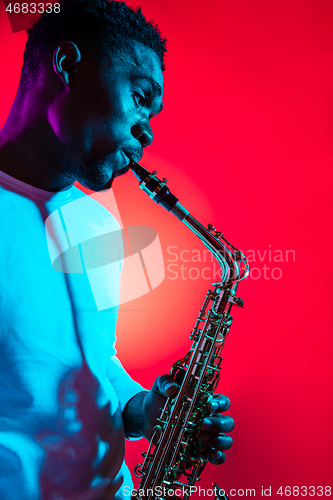 Image of African American jazz musician playing the saxophone.