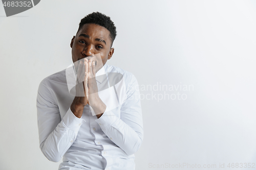 Image of Closeup portrait of handsome young man shocked surprised, pray, isolated on grey background. Negative human emotion facial expression feeling concept.