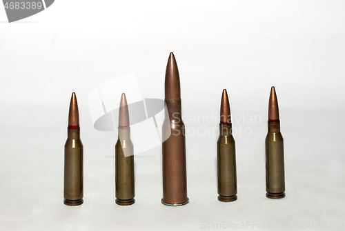 Image of five machine gun cartridges