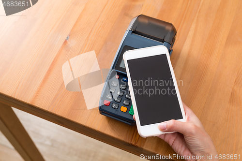 Image of Cellphone pay on pos machine