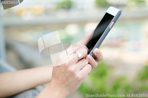 Image of Woman using smart phone