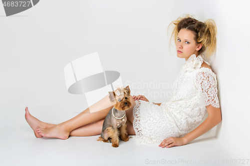 Image of Girl with yorkie dog
