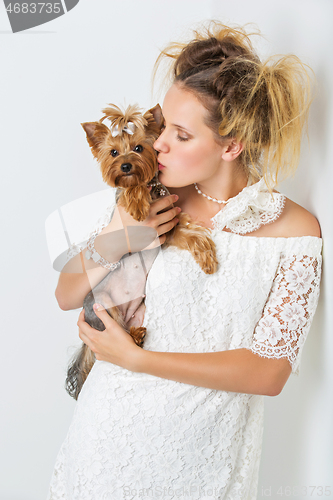 Image of Girl with yorkie dog