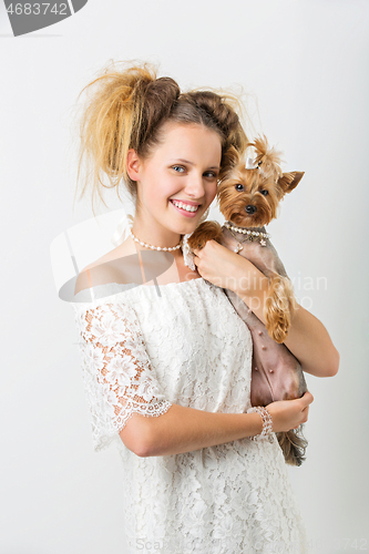 Image of Girl with yorkie dog