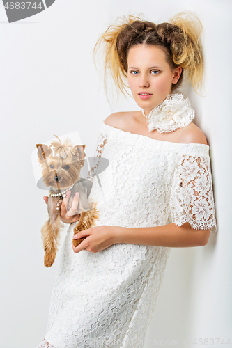 Image of Girl with yorkie dog