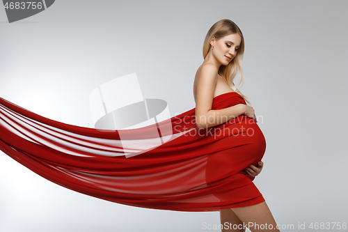 Image of Pregnant girl in red dress