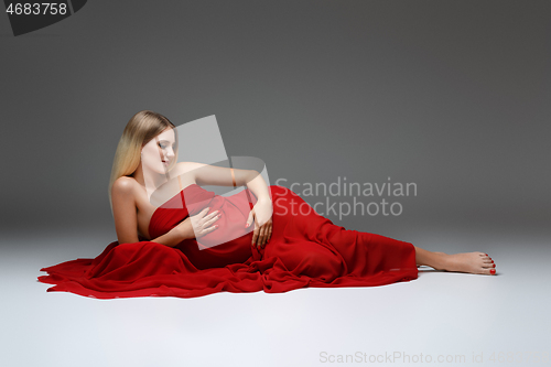 Image of Pregnant girl in red dress