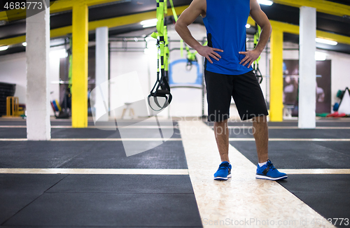 Image of Young  man doing pushups