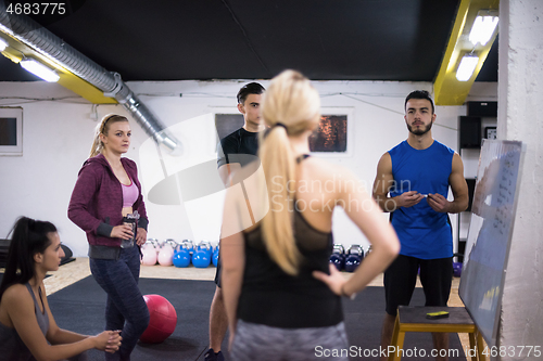 Image of athletes getting instructions from trainer