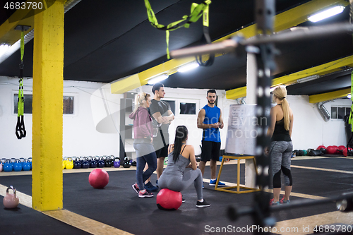 Image of athletes getting instructions from trainer