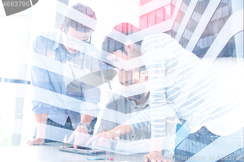 Image of group of Business People Working With Tablet in startup office