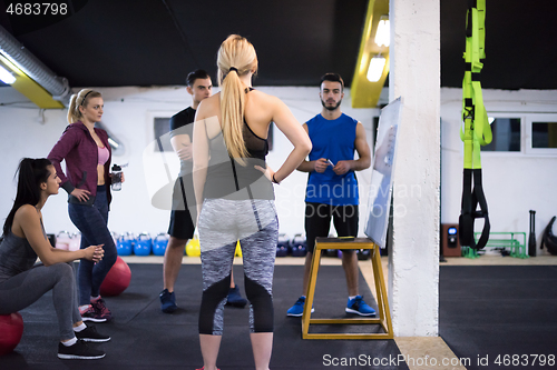 Image of athletes getting instructions from trainer