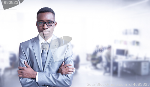 Image of Young businessman in his office
