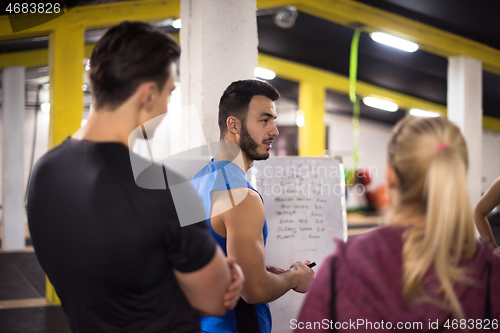 Image of athletes getting instructions from trainer