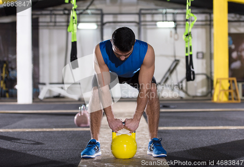 Image of man exercise with fitness kettlebell