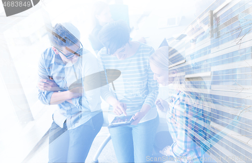 Image of group of Business People Working With Tablet in startup office