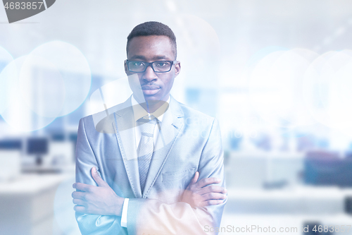 Image of Young businessman in his office