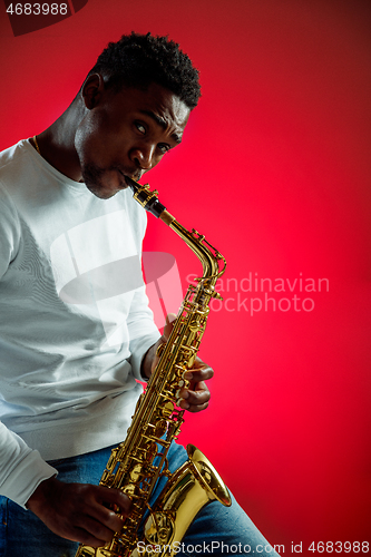 Image of African American jazz musician playing the saxophone.