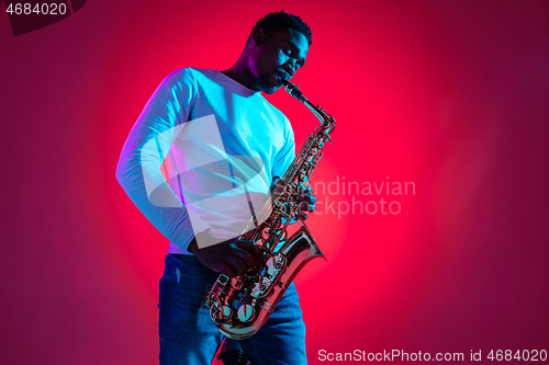 Image of African American jazz musician playing the saxophone.