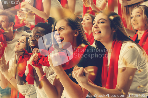 Image of Group of happy fans are cheering for their team victory.