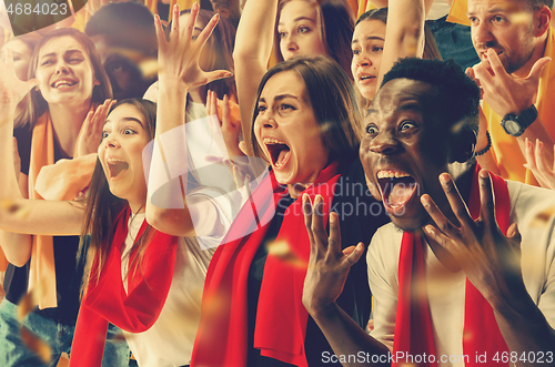 Image of Group of happy fans are cheering for their team victory.