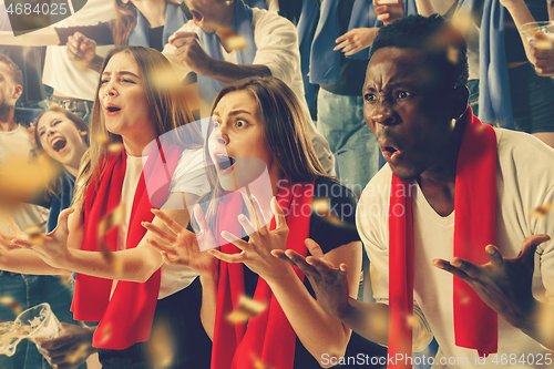 Image of Group of happy fans are cheering for their team victory.