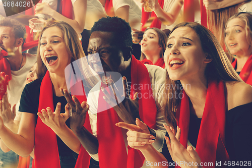 Image of Group of happy fans are cheering for their team victory.