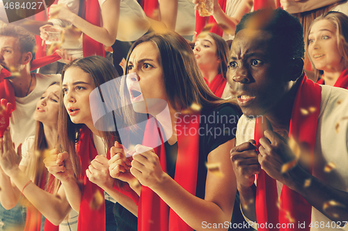 Image of Group of happy fans are cheering for their team victory.