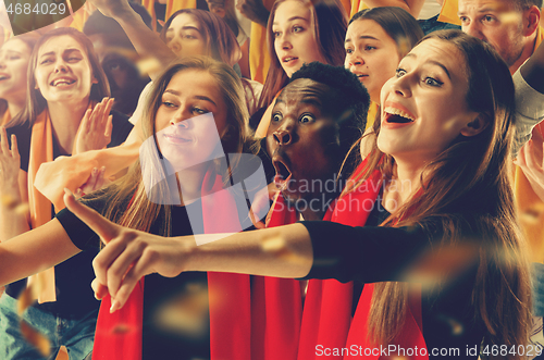 Image of Group of happy fans are cheering for their team victory.