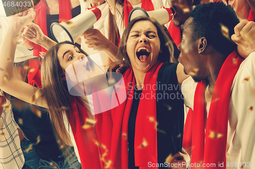 Image of Group of happy fans are cheering for their team victory.