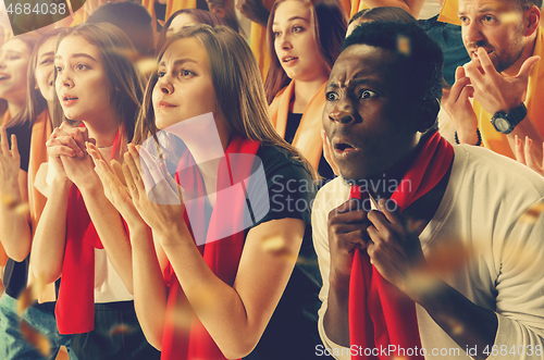 Image of Group of happy fans are cheering for their team victory.