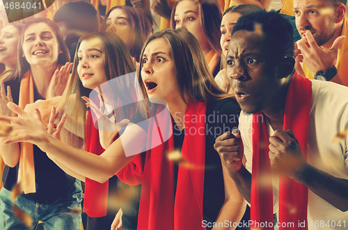 Image of Group of happy fans are cheering for their team victory.