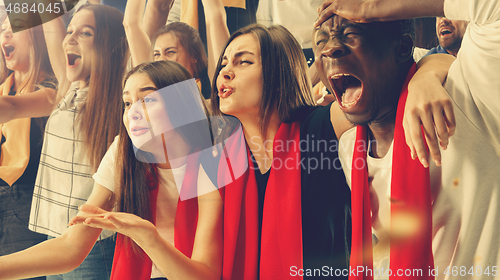 Image of Group of happy fans are cheering for their team victory.