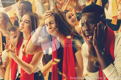 Image of Group of happy fans are cheering for their team victory.