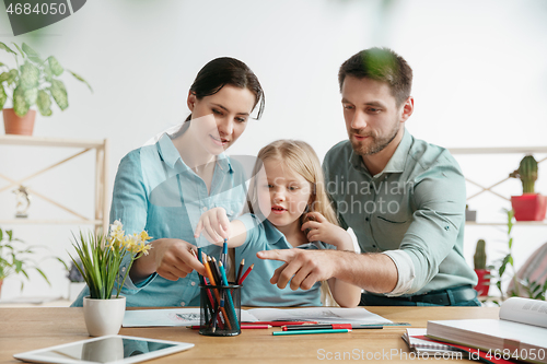 Image of Young happy family are spending time together. A day in lovely home.