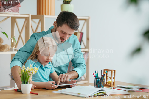 Image of Young happy family are spending time together. A day with loved ones at home.