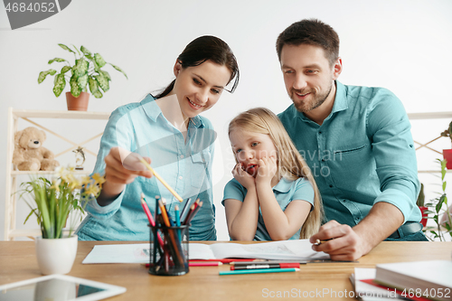 Image of Young happy family are spending time together. A day in lovely home.