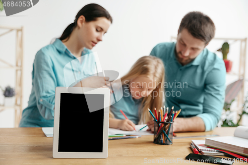 Image of Young happy family are spending time together. A day with loved ones at home.