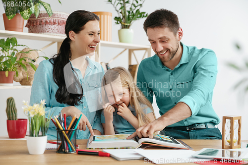 Image of Young happy family are spending time together. A day with loved ones at home.